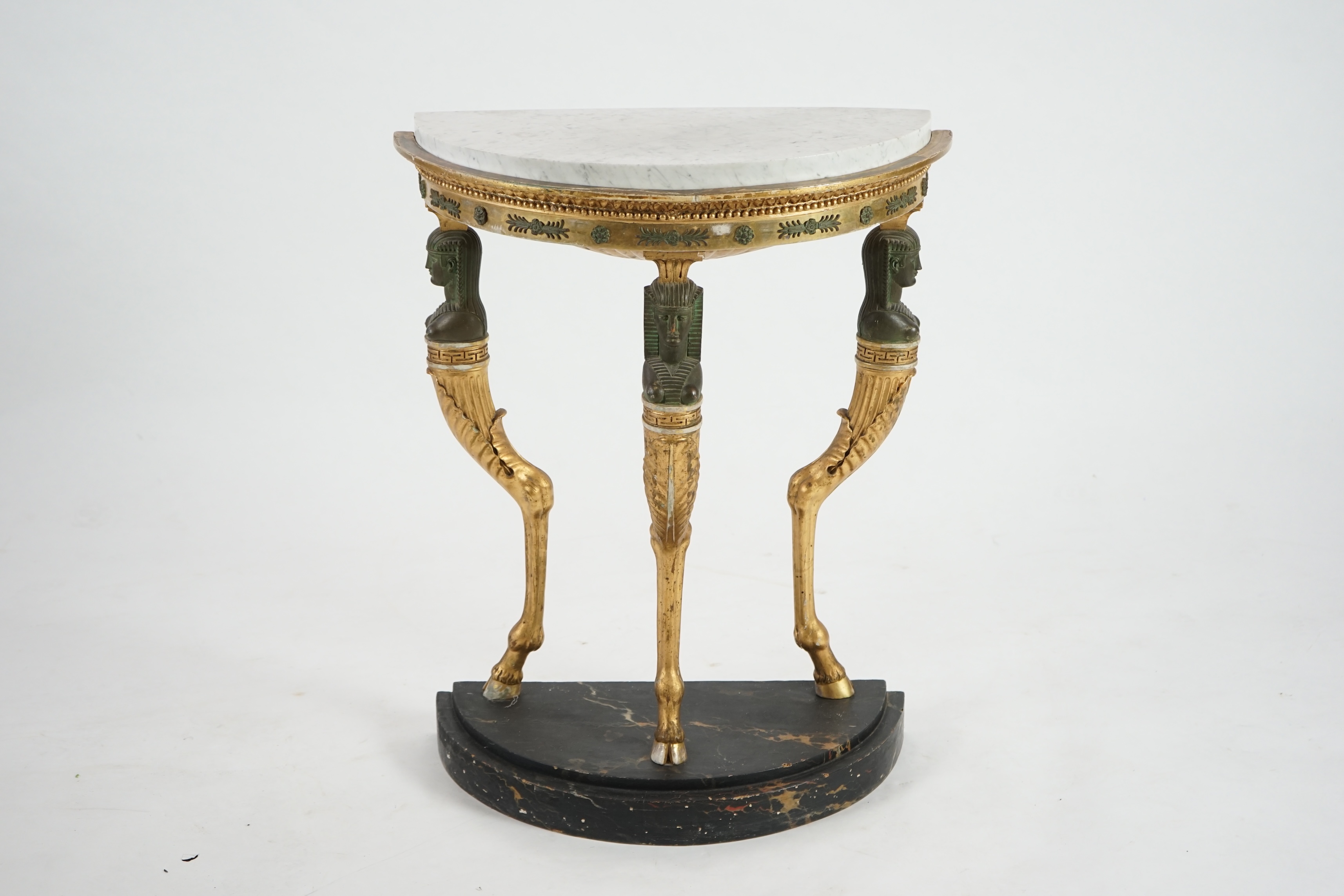 A Regency bronzed and giltwood demi-lune console table, in the manner of Thomas Hope